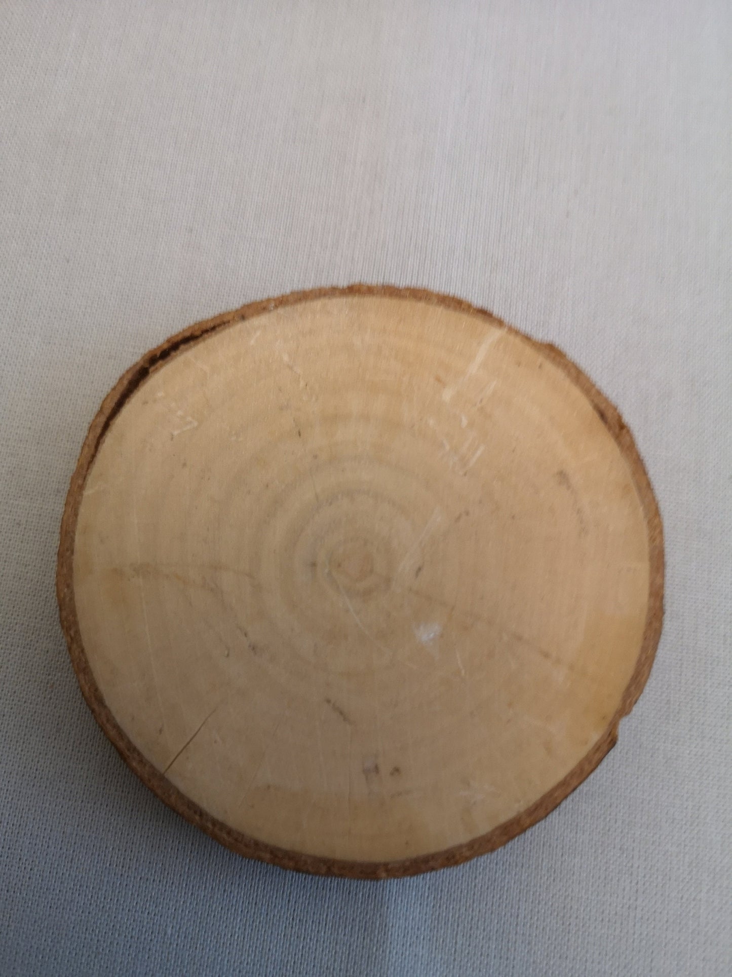 Rustic handmade laser engraved wooden slices.