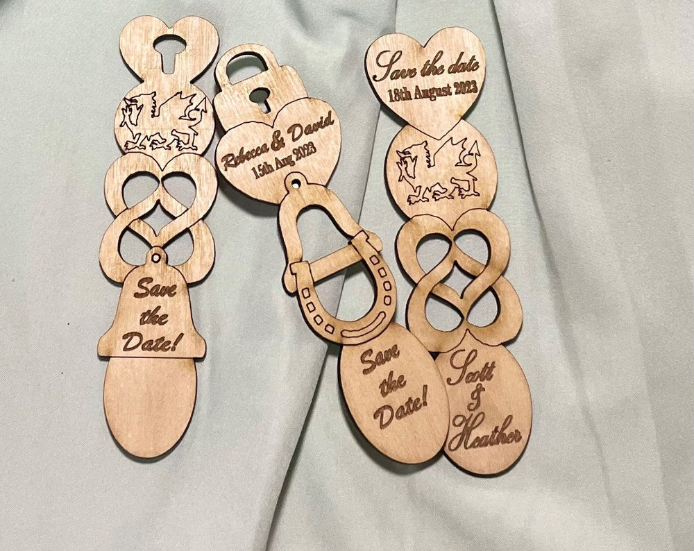 Beautiful handmade Welsh Lovespoon 'save the date' fridge magnets.