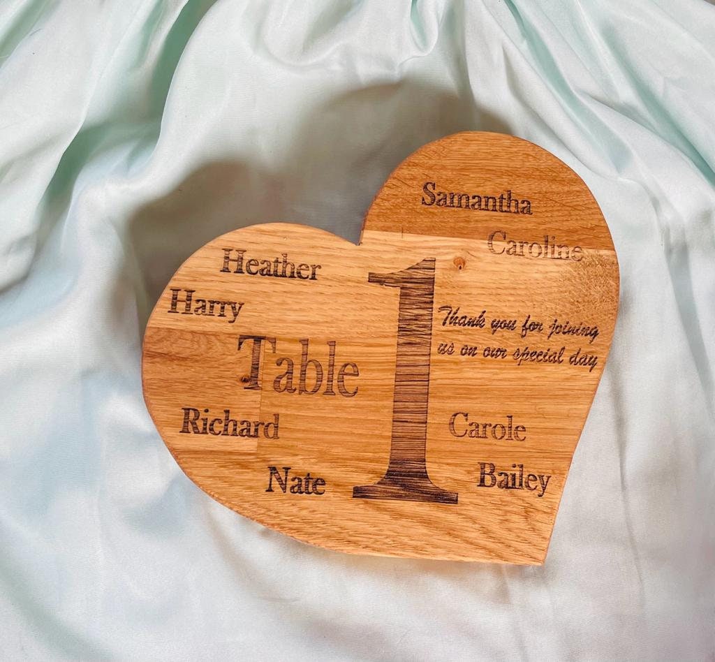 Oak handmade wooden table numbers and seat markers for weddings and parties.