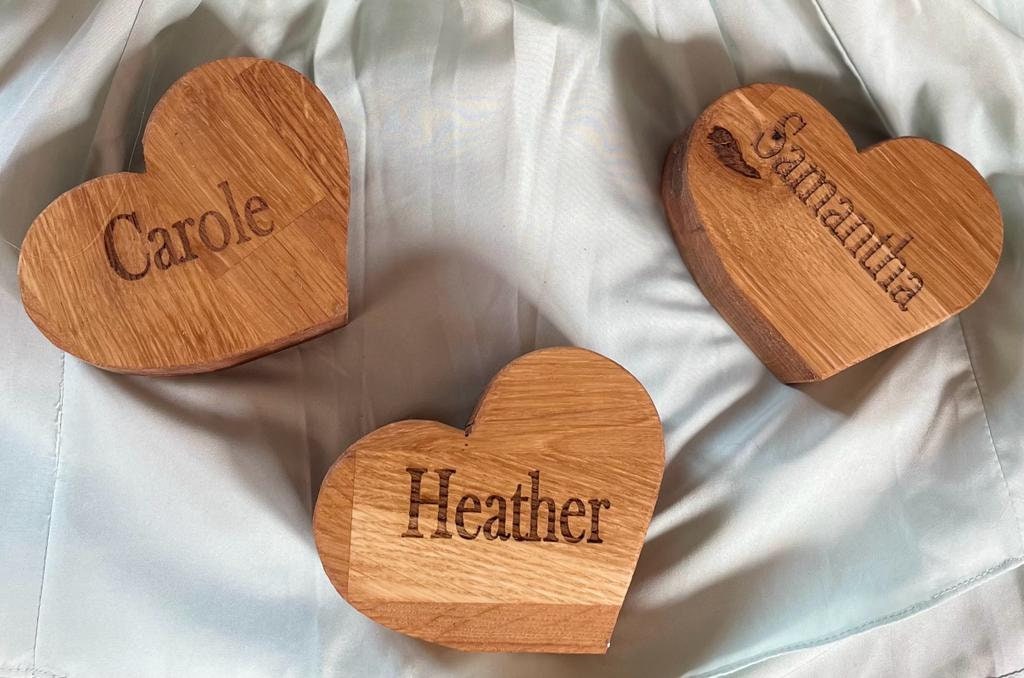 Oak handmade wooden table numbers and seat markers for weddings and parties.