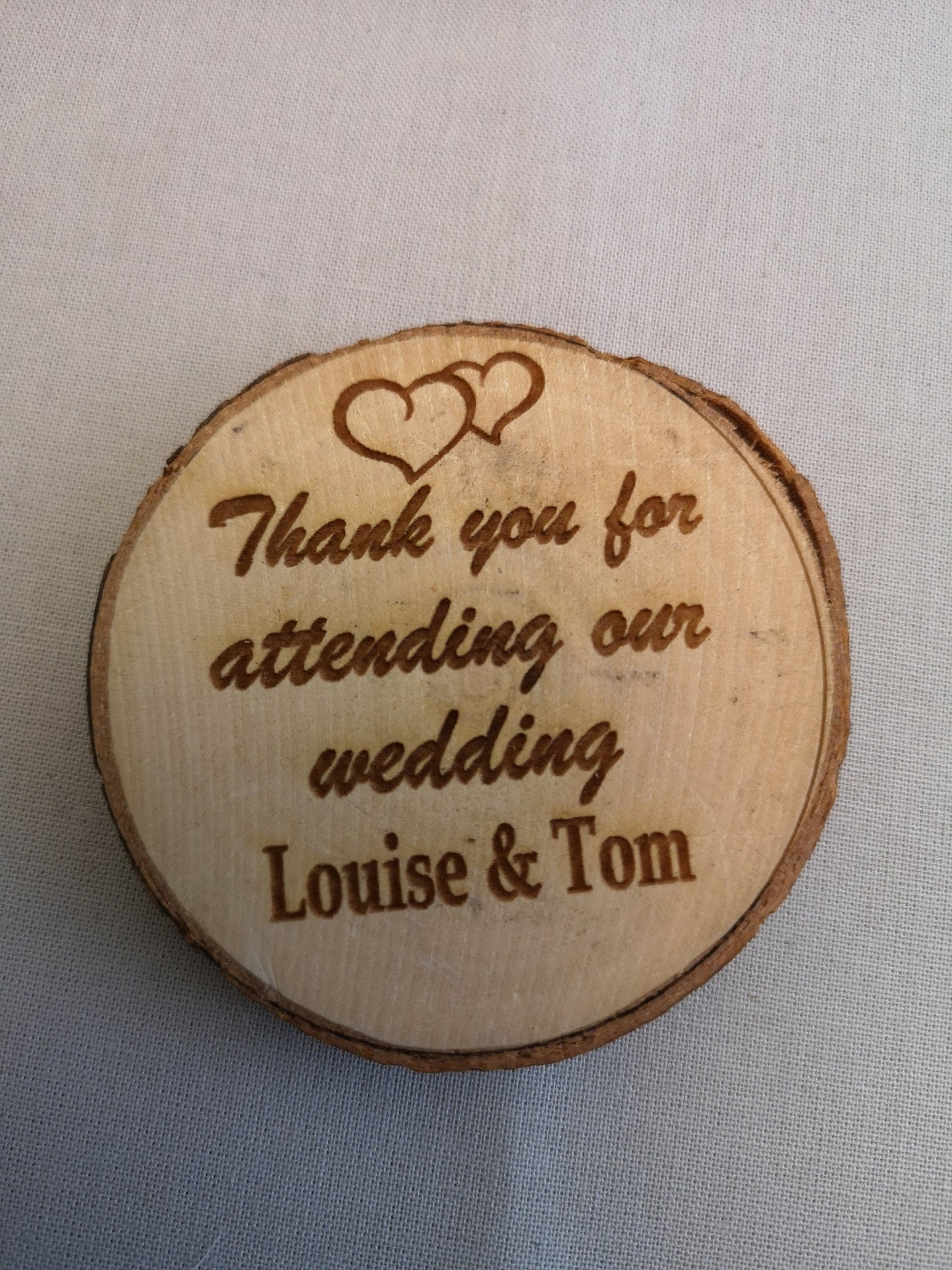 Rustic handmade laser engraved wooden slices.