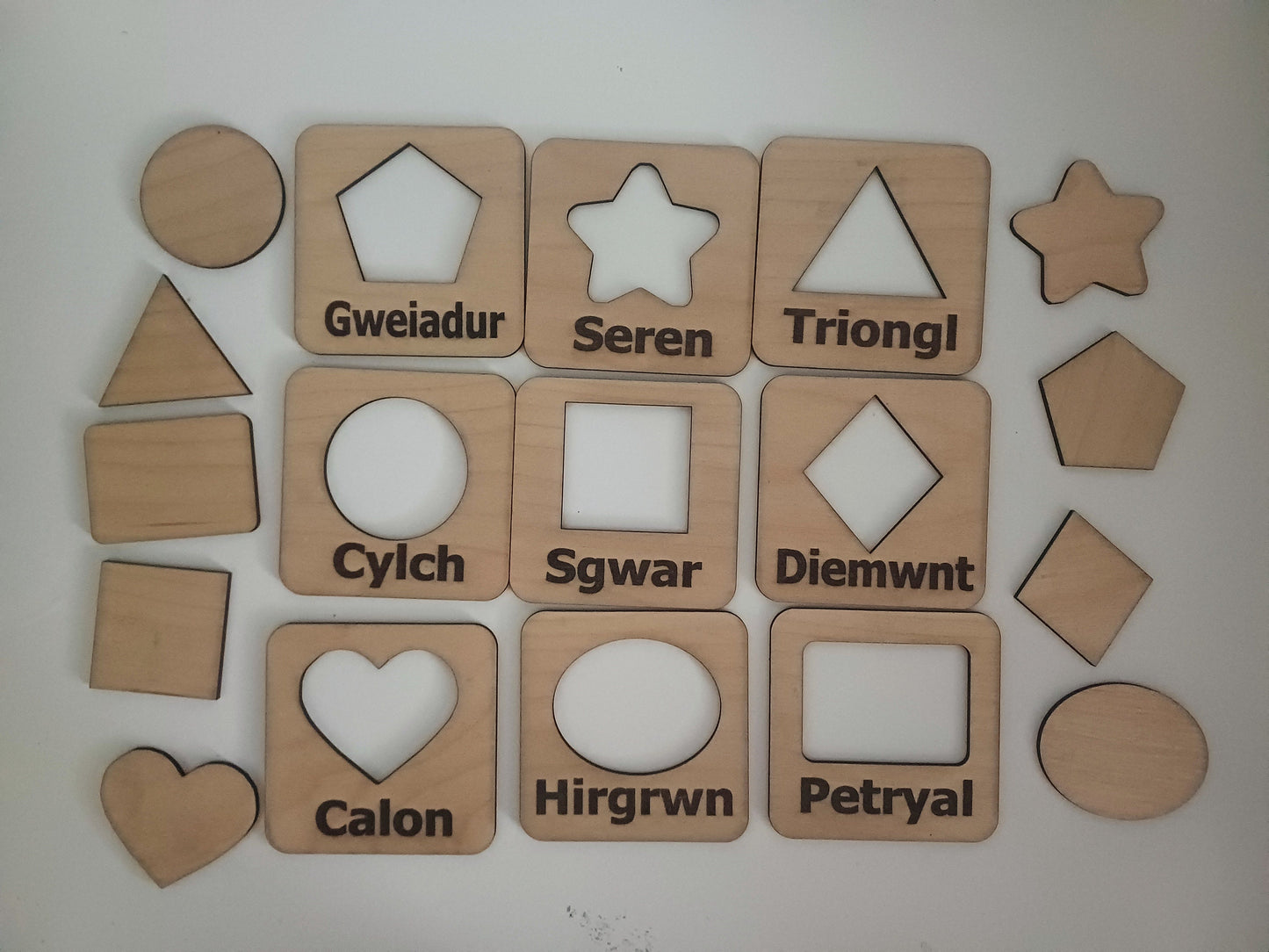 Wooden educational Welsh language stencil and shapes Montesorri style hands on learning