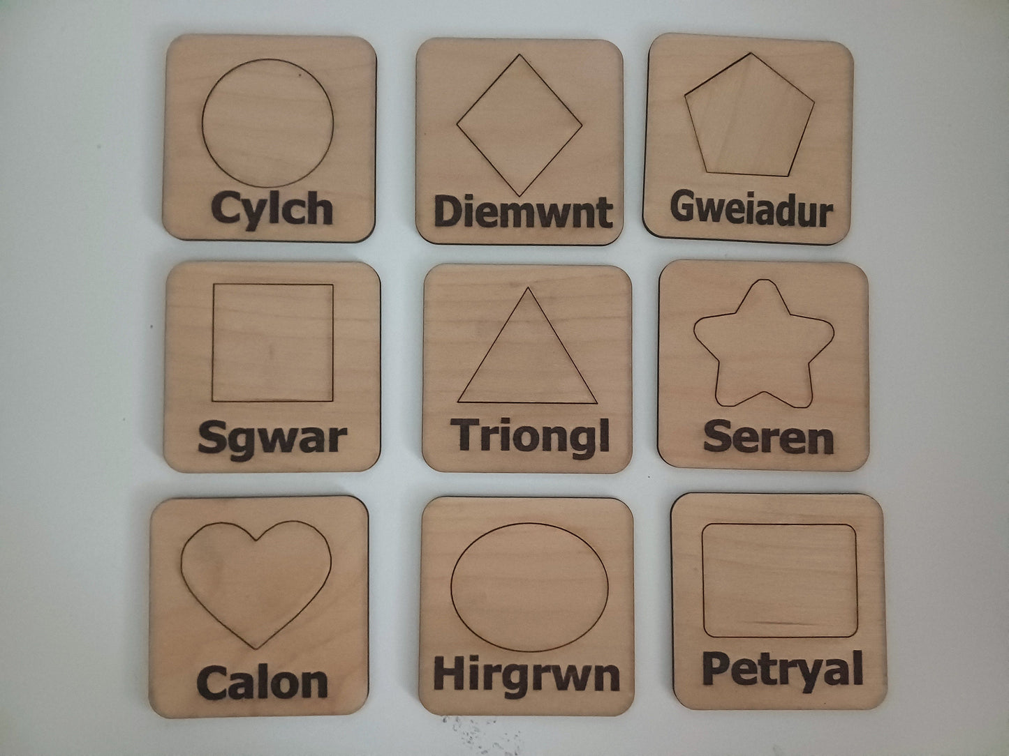 Wooden educational Welsh language stencil and shapes Montesorri style hands on learning